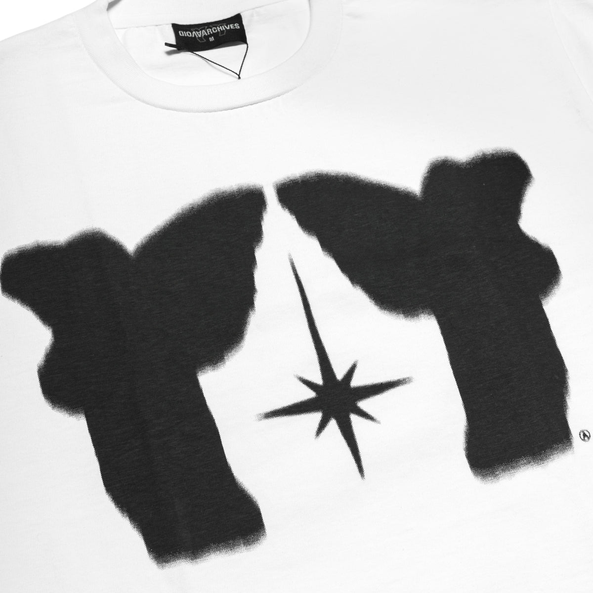 Close-up of the hand-screen-printed black mirrored angel graphic and central star on the Avoid Twin Angel Tee White.